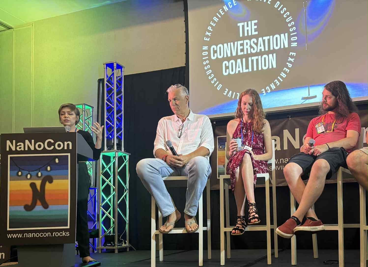 On-stage panel, morning of July 27, 2025 — Elliott seated at right